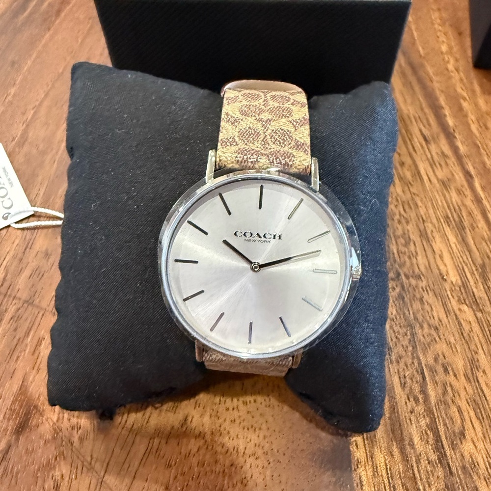 Coach watch with signature band.